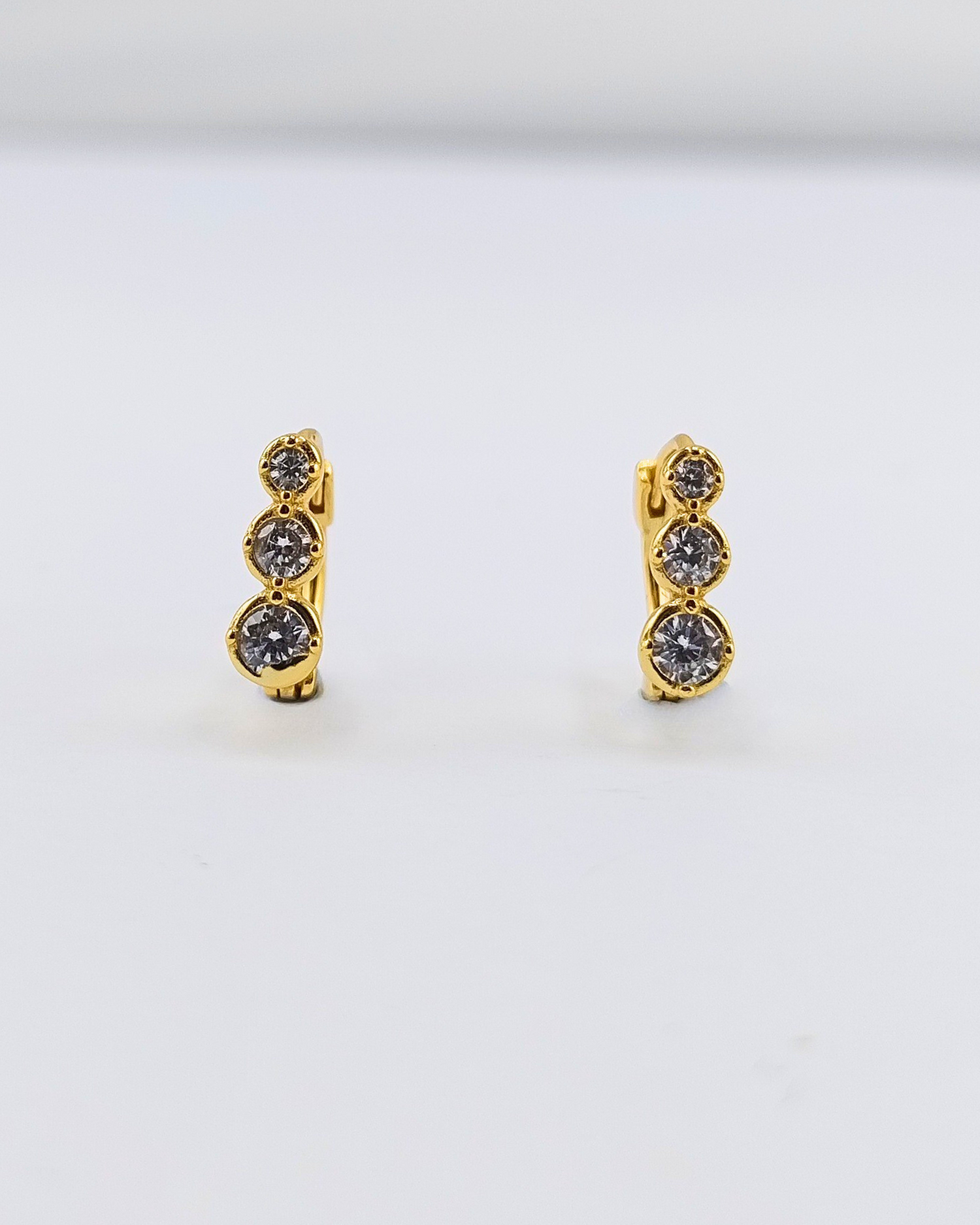 Izoa Célie Crystal Huggie Earrings