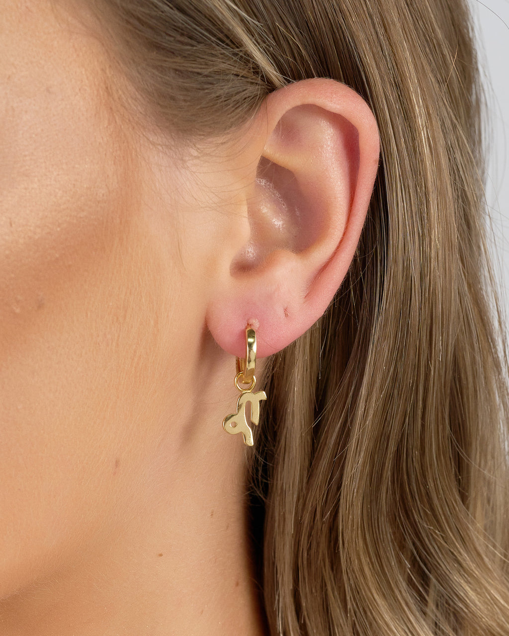 Izoa Capricorn Star Sign Symbol Huggie Earrings Gold